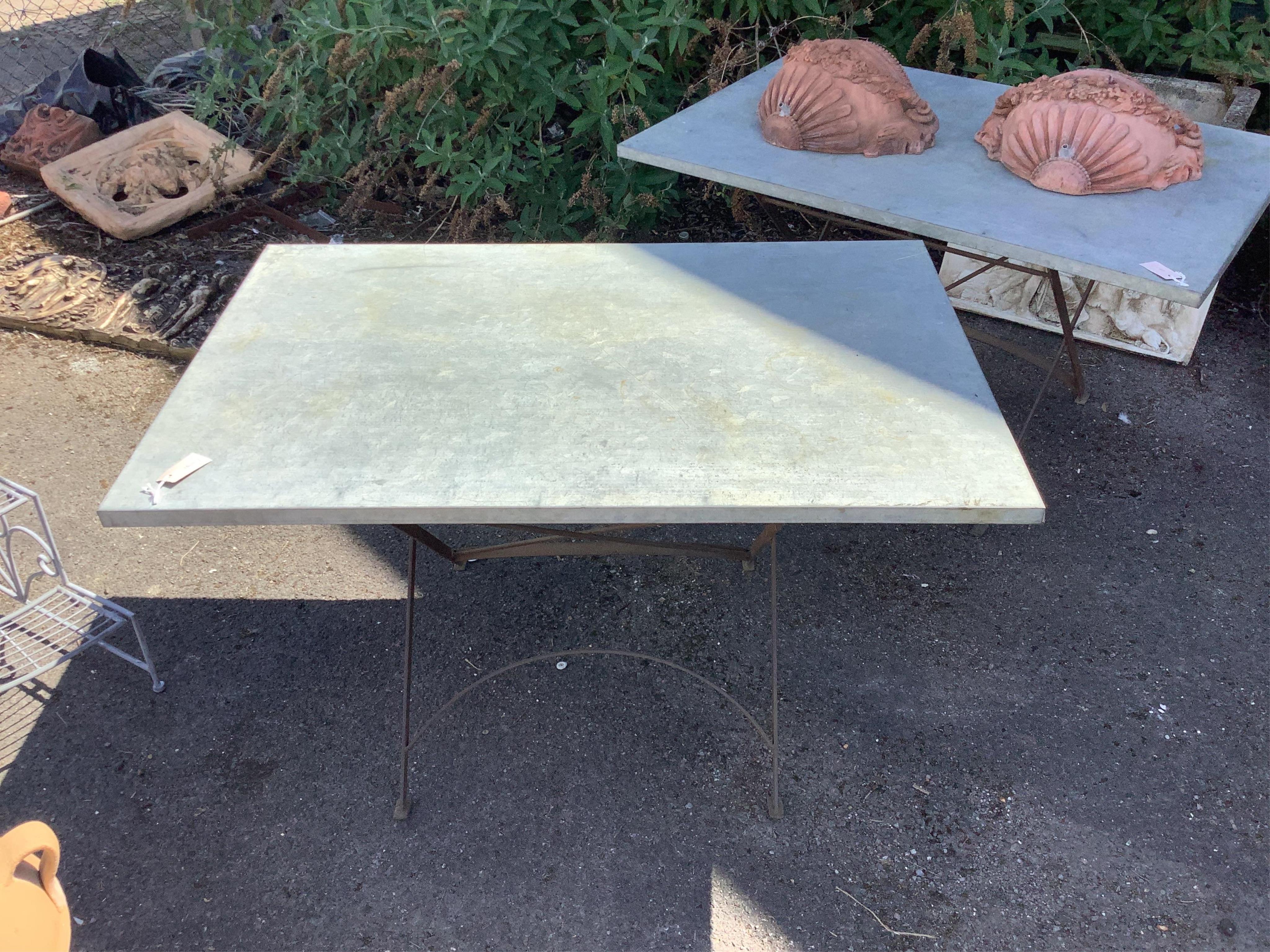 A rectangular zinc topped wrought iron garden table, width 120cm, depth 80cm, height 70cm